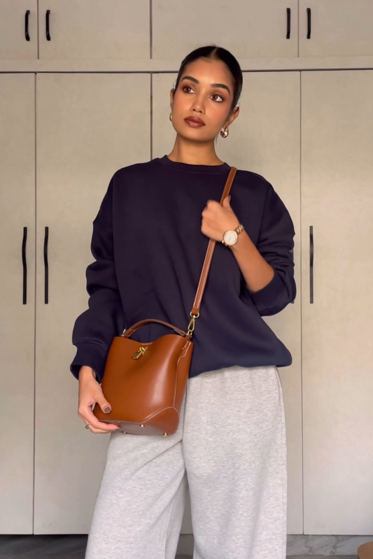 Raseeka in navy crewneck