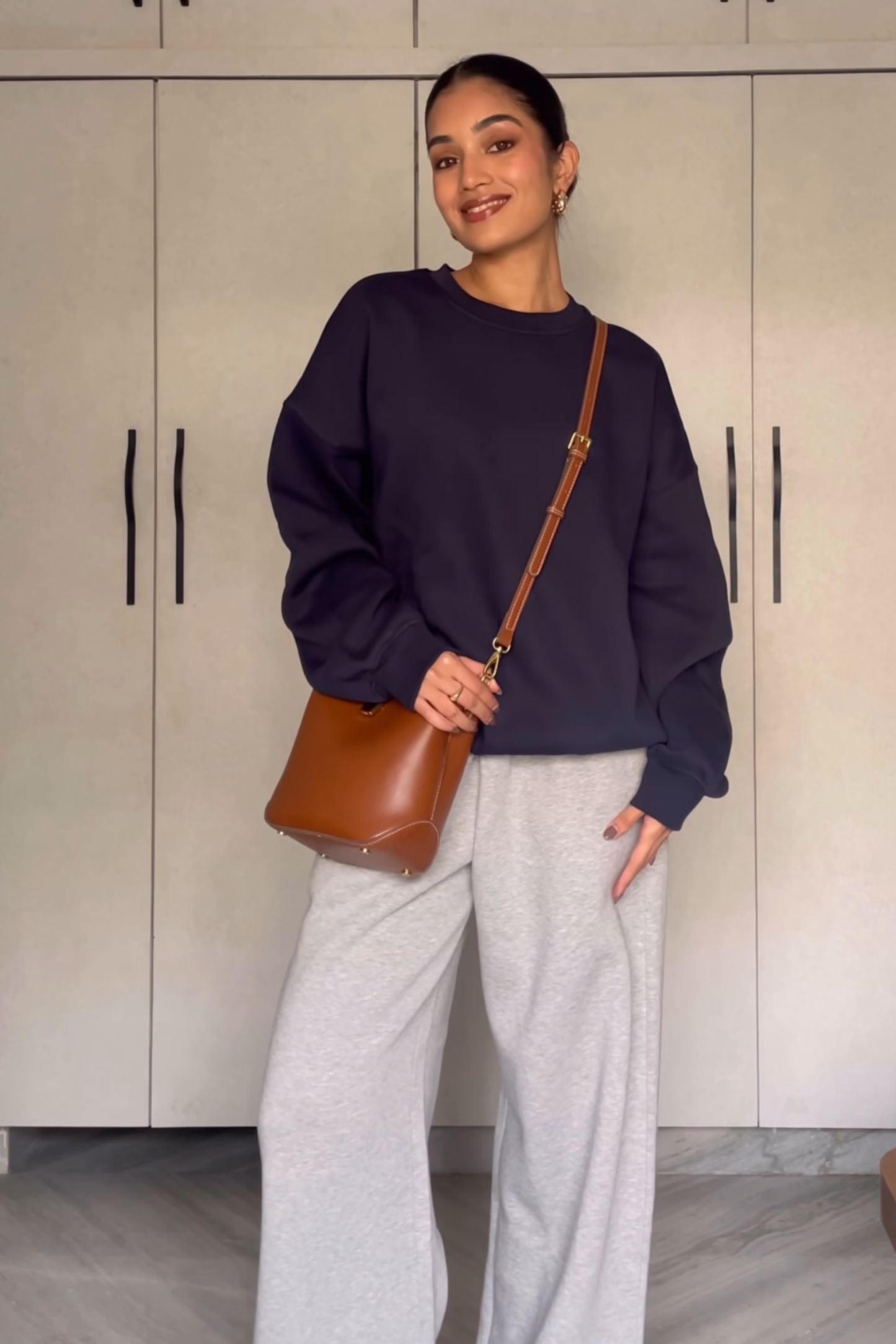 Raseeka in navy crewneck