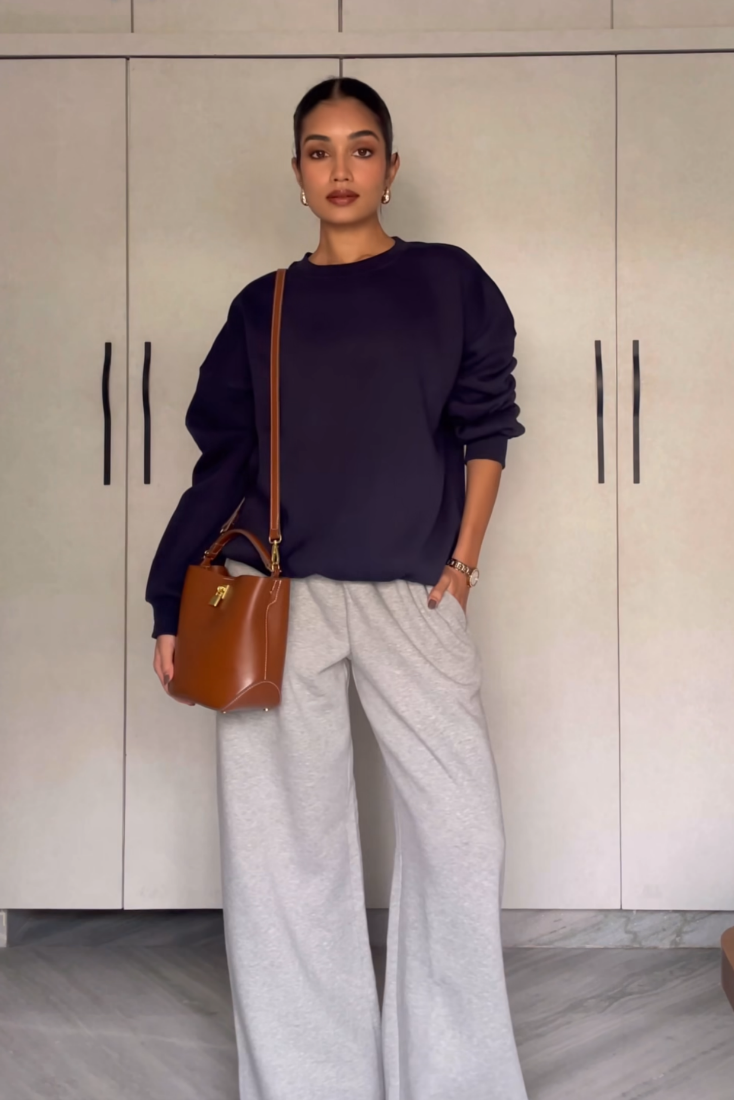 Raseeka in navy crewneck