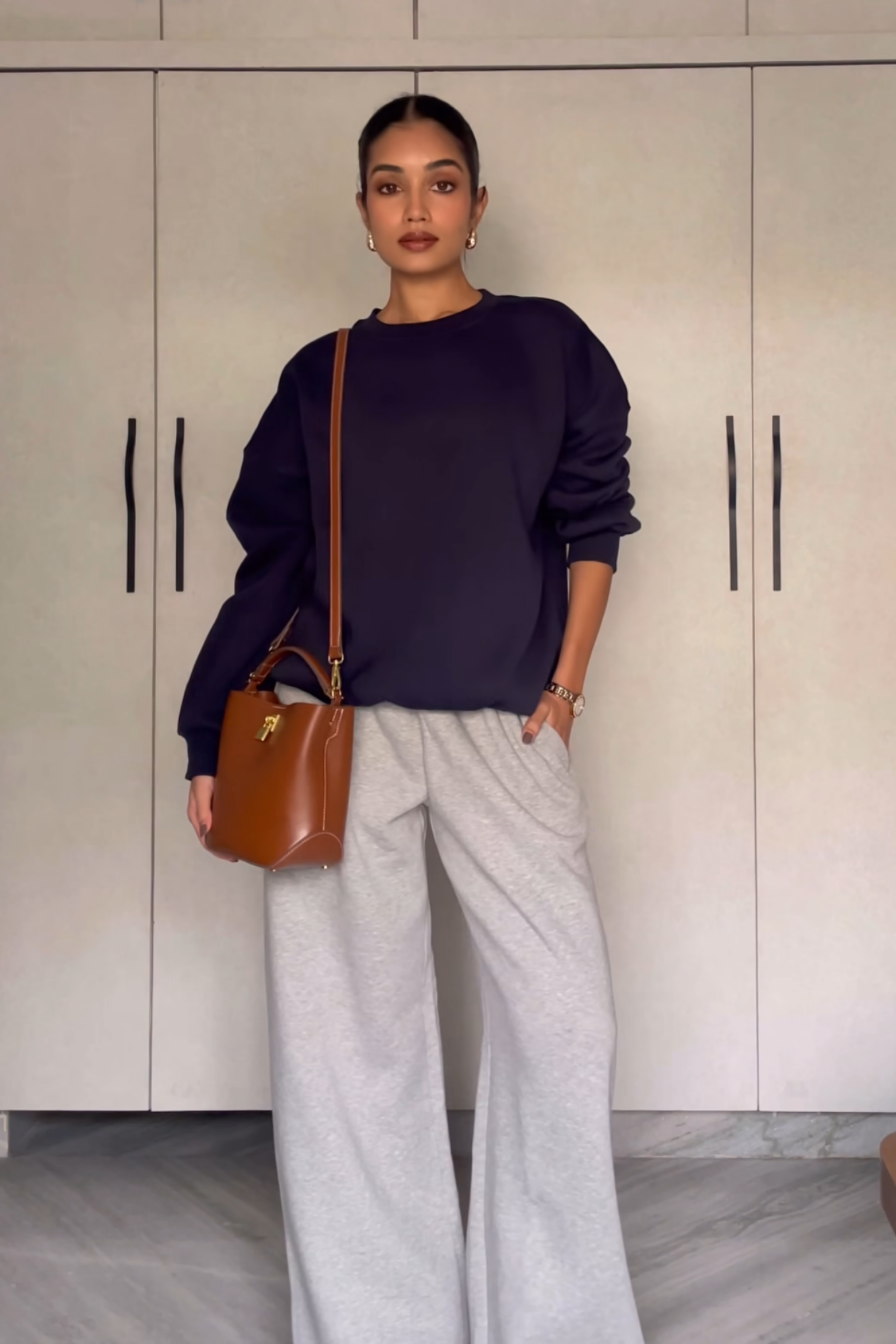 Raseeka in navy crewneck